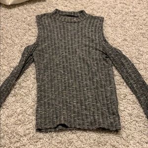 Gray sweater with holes over the shoulders